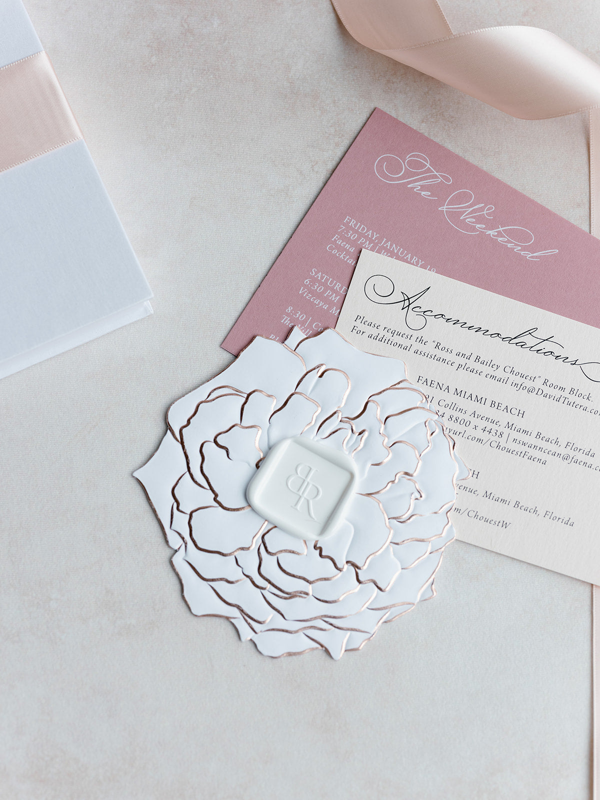 Invitation card with decorative floral design on a light background